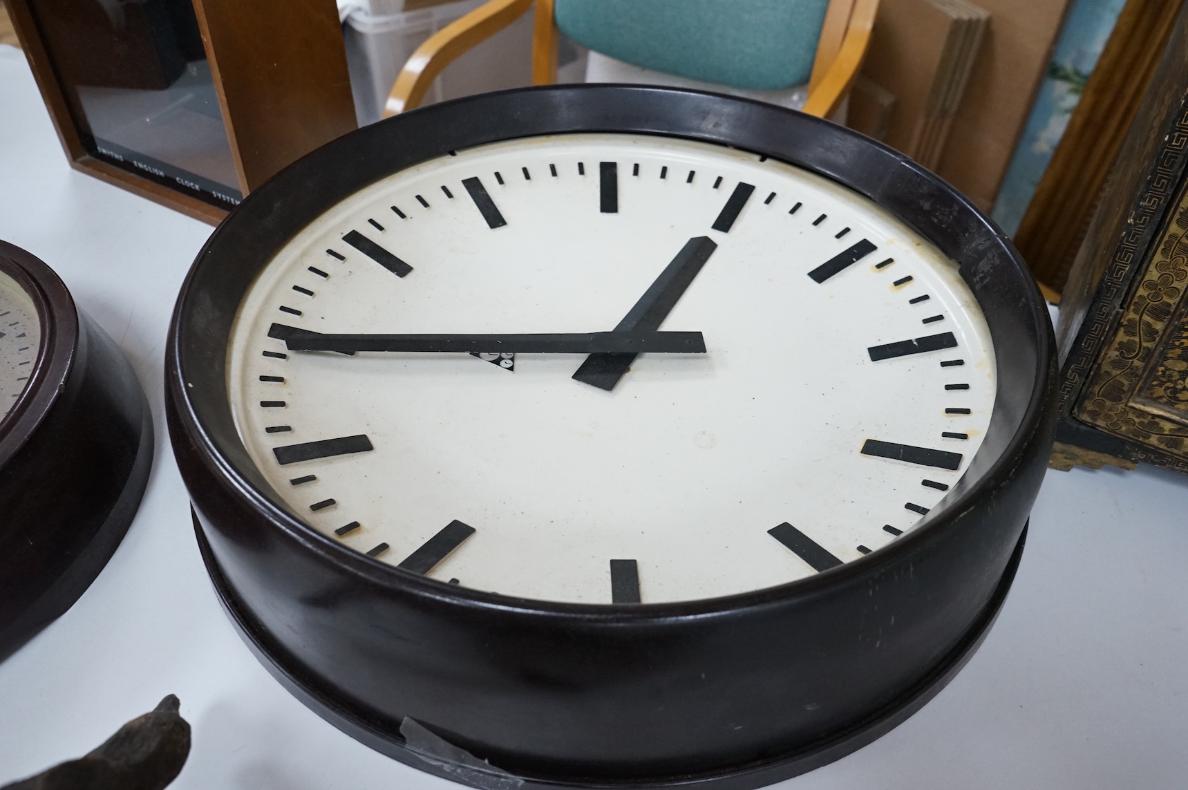 Two 20th century electric wall clocks, including a Smith’s Bakelite example, largest 47cm diameter